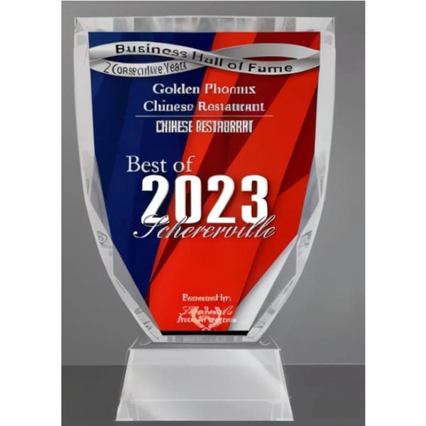 Golden Phoenix Chinese Restaurant's "Best of 2023 Schererville" award, a clear acrylic trophy with red and blue.